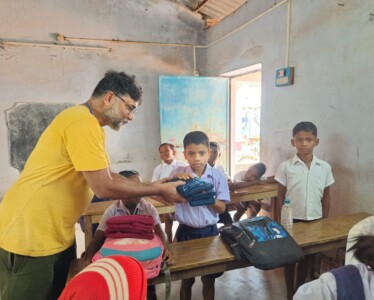 Our Ambassador Shri Bidhan Debnath distributing Cotswool thermal wear among the children of Tulsiboni Primary School, Belpahari Our Ambassador Shri Bidhan Debnath distributing Cotswool thermal wear among the children of Tulsiboni Primary School, Belpahari.