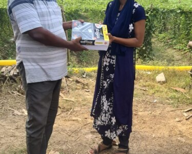 Shri Prasenjit Jana, teacher of Patna Vivekananda Sikshaniketan, handing over few books to beneficiary Saswati Hazra
